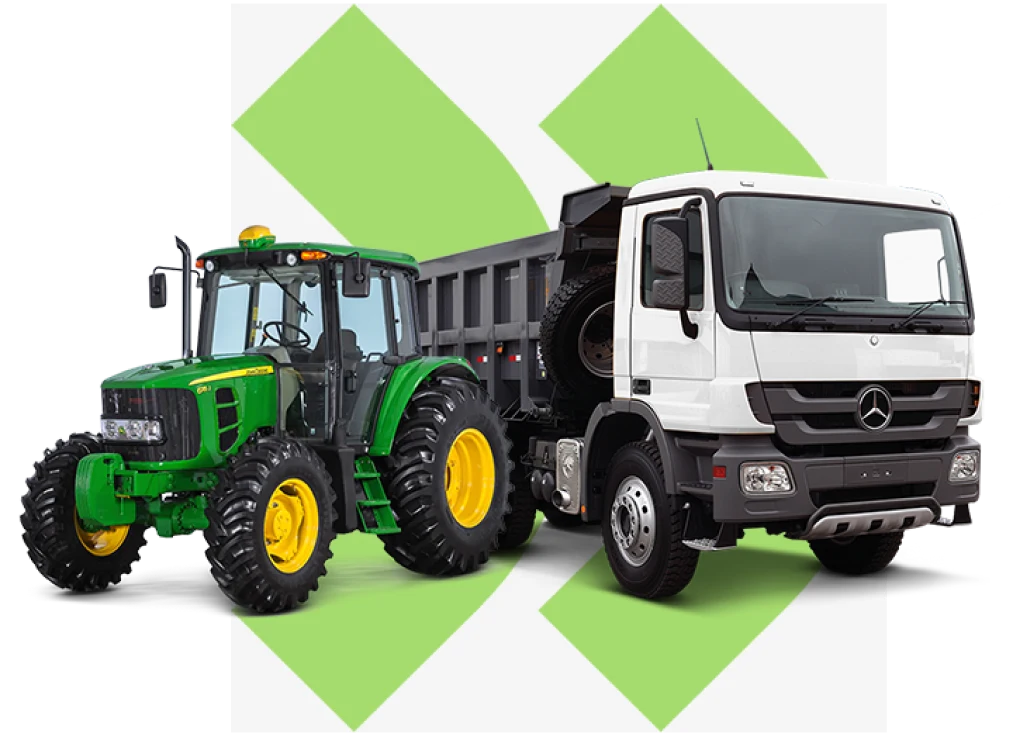 Trator John Deere e caminhão basculante branco lado a lado, representando a frota de locação de veículos pesados para agronegócio, construção civil e transporte de cargas.